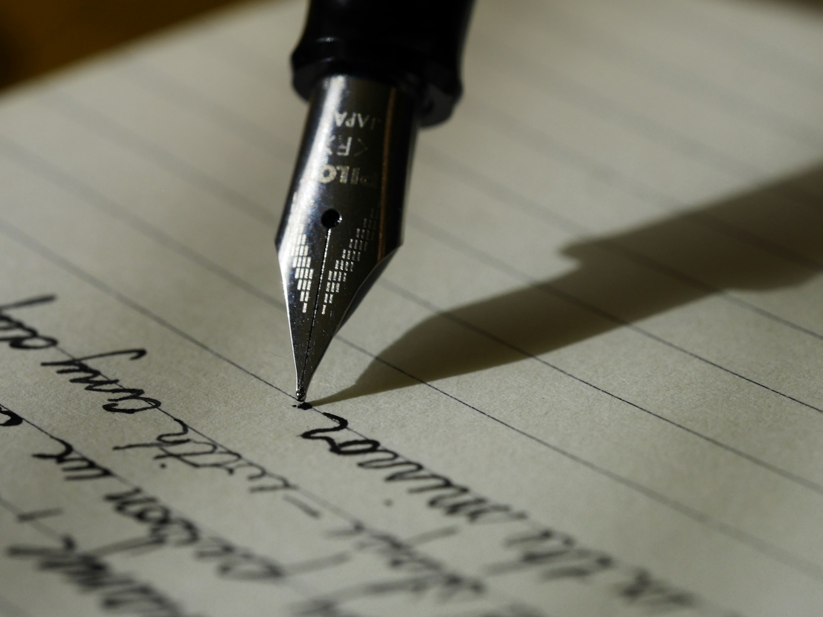 A fountain pen and a handwritten page